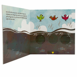 Children's book page with bird illustrations and cutout shapes